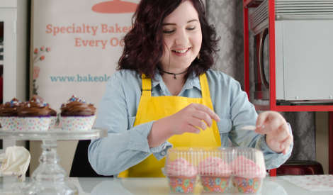 Girl packing cupcakes