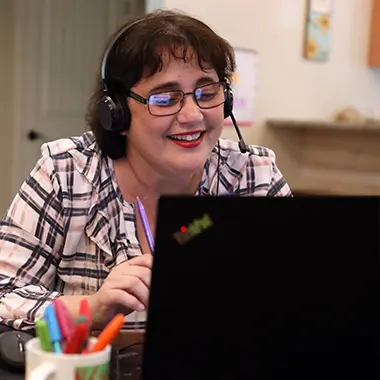 Minnesota teacher working with her laptop